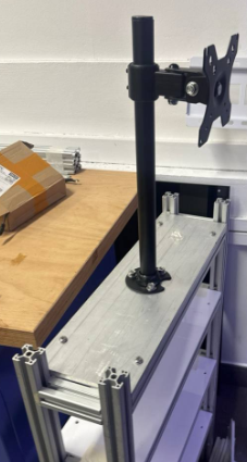 Figure 61: Monitor Arm Screwed onto the Metal Plate